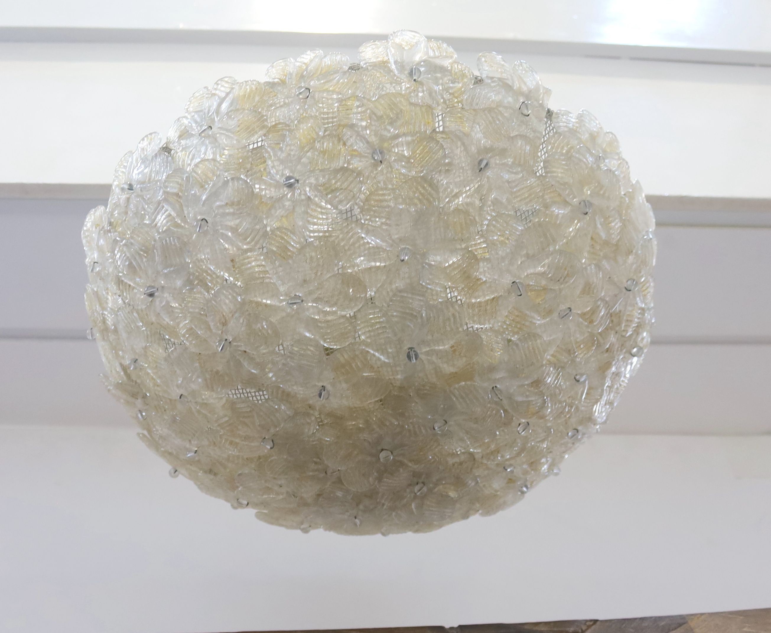 A 1960's Venetian gilt glass flower petal plaffonier, possibly Murano, 40 cms diameter. diameter 42cm.